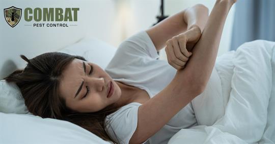 Woman lying in bed with skin irritation itching allergy